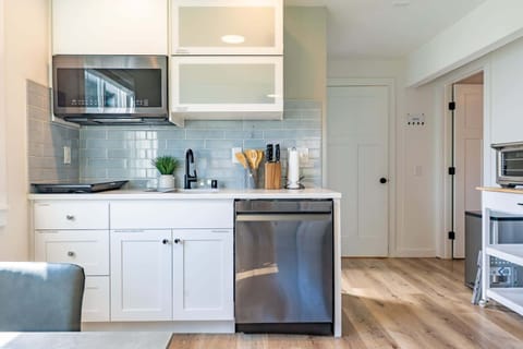 Kitchen offers a welcoming atmosphere where guests can gather, chat, and feel right at home.