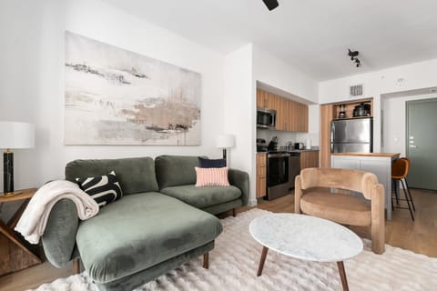 Unwind in the sophisticated ambiance of this contemporary lounge, featuring a cozy yet stylish accent chair.