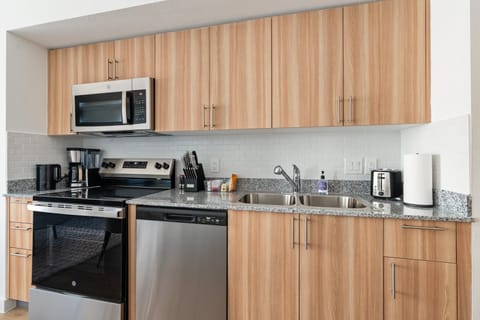 Craft tasty dishes in this contemporary kitchen with all the necessary amenities.