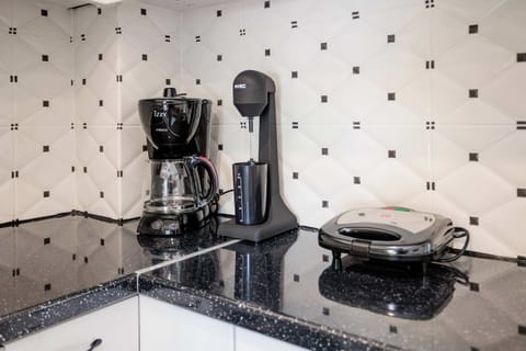 Coffee Station with Espresso Machine and Utensils – Perfect for enjoying your morning cup of coffee.