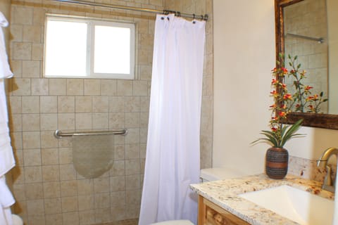 Main half bath with shower and cotton towels
