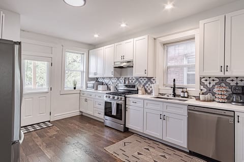 Charming Kitchen: Whip up culinary delights with modern appliances and stylish decor!