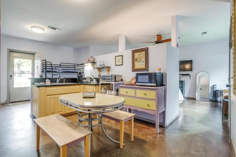 Open kitchen and dining space with room to gather and enjoy meals together during your stay.