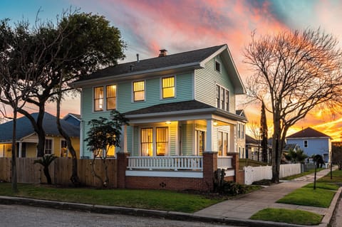 Charming coastal home glowing at golden hour