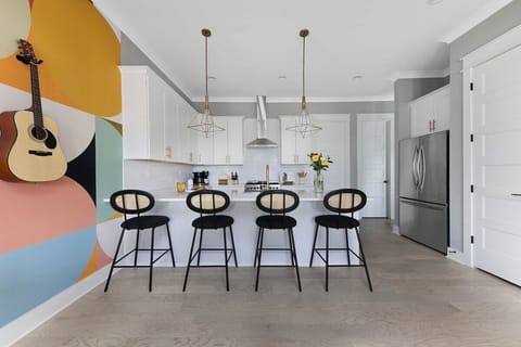 Guitars throughout the home for a true Nashville feel (125 Lucile)