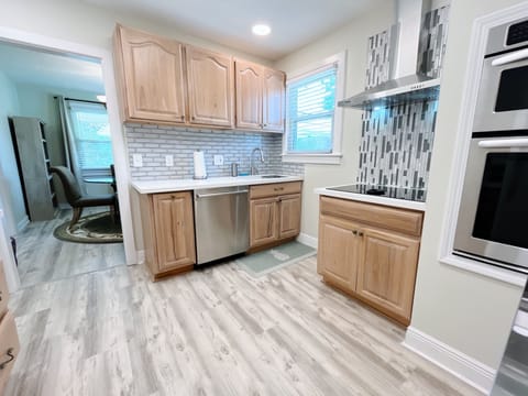 Fully stocked kitchen with full oven. stove, dishwasher, and refrigerator. 