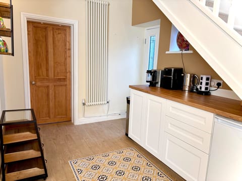 A kitchenette area , with toaster, microwave, air fryer, hot plate , kettle. 