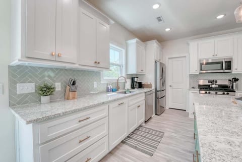 A pristine kitchen, bathed in natural light, promising culinary adventures. Effortless elegance awaits.