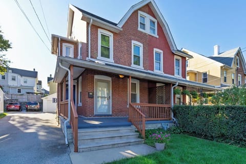 Front of house with driveway and back off-street parking spot.