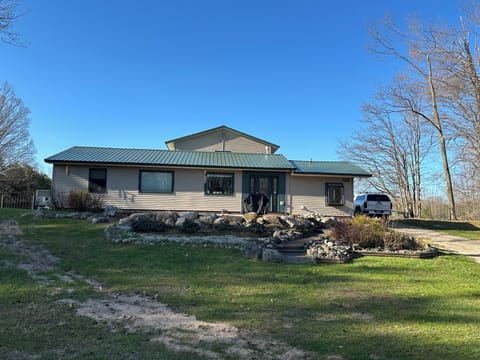 Front view of home from spacious front yard