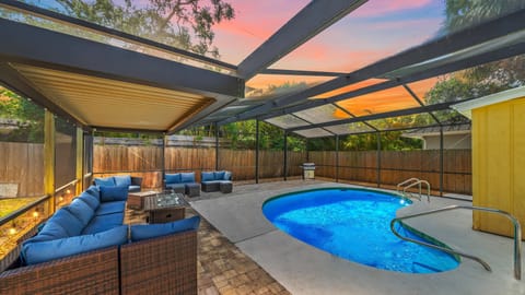 Dive into your private, screened-in oasis where the heated pool, gas grill, and cozy firepit lounge create the perfect setting for unforgettable Sarasota evenings.