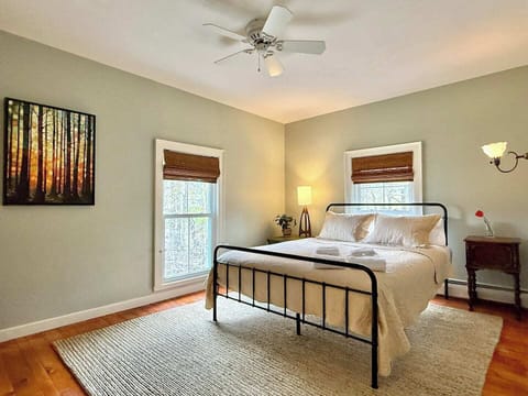 Wake up refreshed in this cozy and airy retreat, complete with blackout shades, plush bedding, and a relaxing vibe.