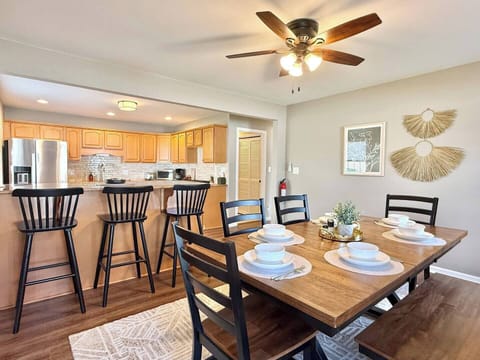 Gorgeous dining area, breakfast bar adjacent to the kitchen. Enjoy meals with the family and chat while cooking