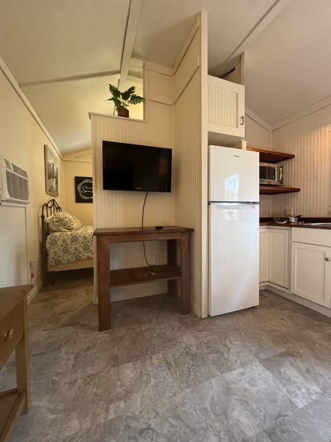 TV Table doubles as table seating you can turn it for more kitchen countertop.