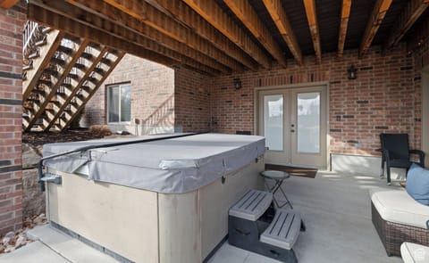 The lower deck is dedicated guest use-complete with hot tub and patio furniture.