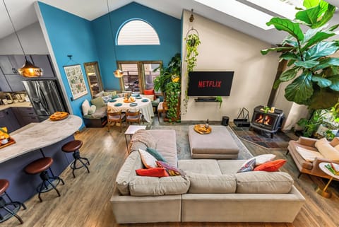 Vibrant hues dance across this inviting space with a charming fireplace!