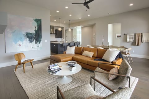 Contemporary open-concept layout connecting the living, dining, and kitchen spaces in effortless style.
