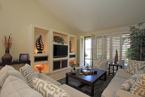 Comfy sofa and love seat with golf course view