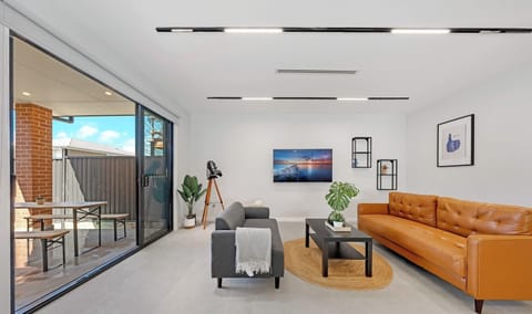 Spacious living area with a sofa and warm homey feel