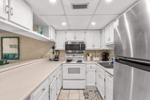 Fully Stocked Kitchen with Keurig Coffee Maker and Breakfast Bar Seating
