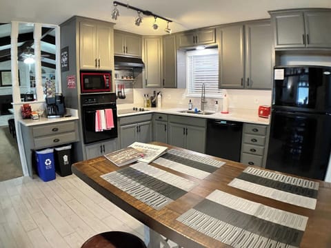 Brand new kitchen with quartz countertops, new sink and commercial style faucet.