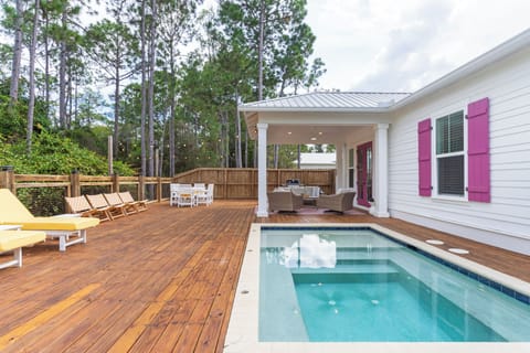 Dive into relaxation with a sparkling plunge pool, sun-drenched deck, and shaded outdoor living