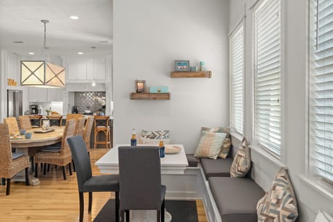 Sun-filled dining nook with built-in bench seating, perfect for casual meals and morning coffee.