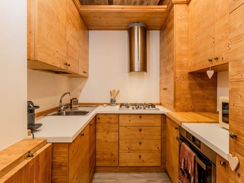 Wood, Kitchen, Cabinetry, Flooring, Countertop, Brown, Wood Stain, Major Appliance, Hardwood, Kitchen Appliance