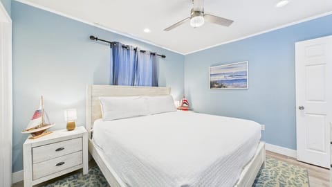 Master bedroom with king bed TV and ensuite bathroom (sleeps 2)