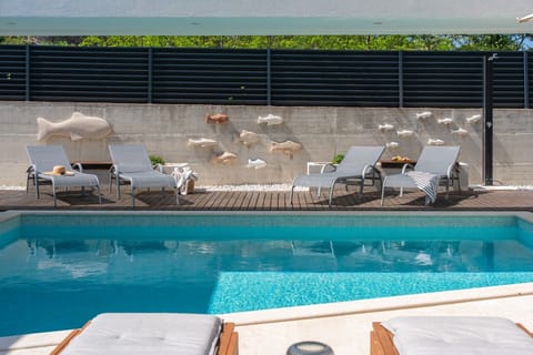 Private 24 sqm swimming pool, surrounded by lush greenery perfect for relaxing under the Mediterranean sun