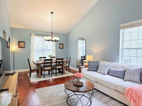 1st living room with seating sofa with TV and dining area
