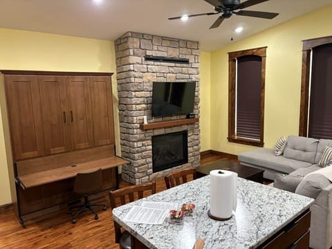 Limestone Lodge Apt A Living Area w/Fireplace & Murphy Bed Desk