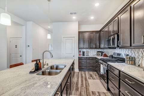 Our kitchen includes stainless steel stove, oven, microwave, dishwasher, fridge.