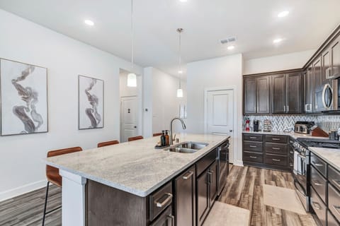 Our kitchen includes stainless steel stove, oven, microwave, dishwasher, fridge.