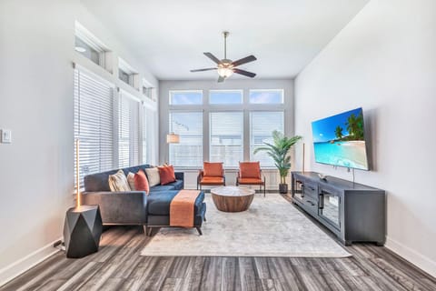 Spacious 1st floor living room with modern decor and 50 Inch TV.  Air purifer!