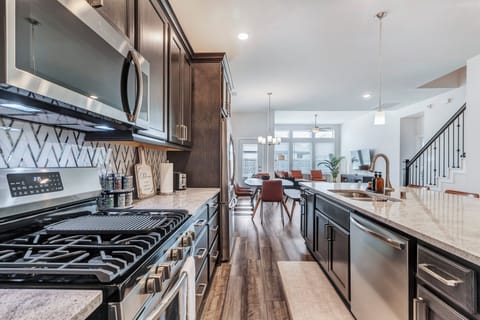 Our kitchen includes stainless steel stove, oven, microwave, dishwasher, fridge.