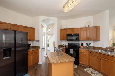 The open, airy kitchen offers ample space & all the comforts of home