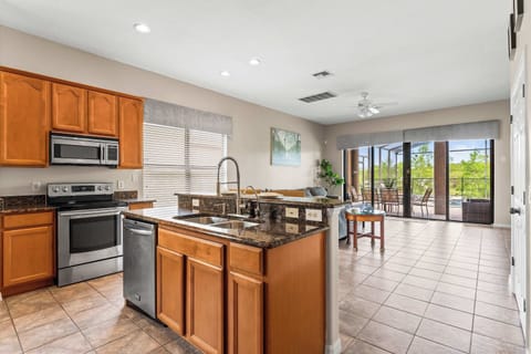 The open, airy kitchen offers ample space & every home comfort
