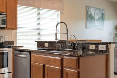 The open, airy kitchen offers ample space & every home comfort