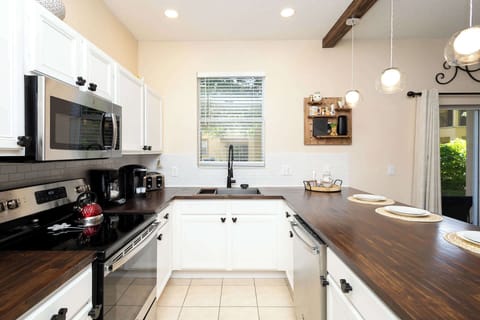 The open, airy kitchen offers ample space & all the comforts of home