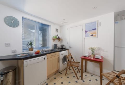 The Studio at Rockside, Polzeath. Ground floor: Including an electric oven and hob, fridge, microwave, Nespresso Vertuo Coffee Machine, and washing machine