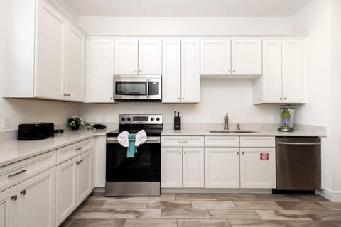 The bright, open kitchen offers ample space & all the comforts of home