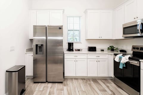 The bright, open kitchen offers ample space & all the comforts of home