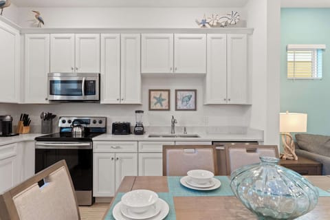 The beachy eat-in kitchen offers ample space & all the comforts of home