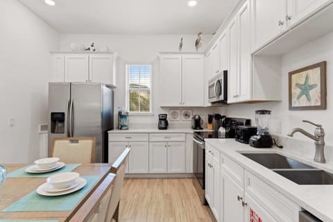 The beachy eat-in kitchen offers ample space & all the comforts of home