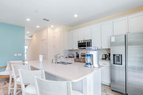 The Kitchen offers ample counter space with seating for 4 at the island