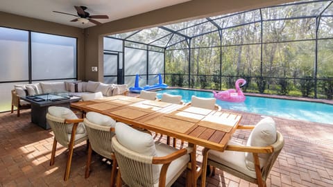 Outdoor dining by the pool with ample seating