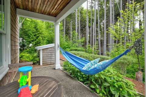 Relax in the backyard, enjoying the greenbelt and forest views. 