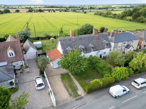 Showcasing the cottages rural setting with parking for up to 5 cars. 