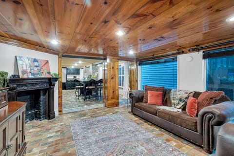 Ample seating, New Orleans flair, and exposed brick flooring give this living space unique personality and comfort.